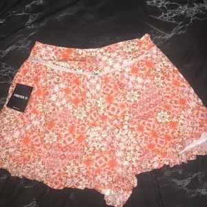 Flowy shorts with ruffled edges +crochet detail